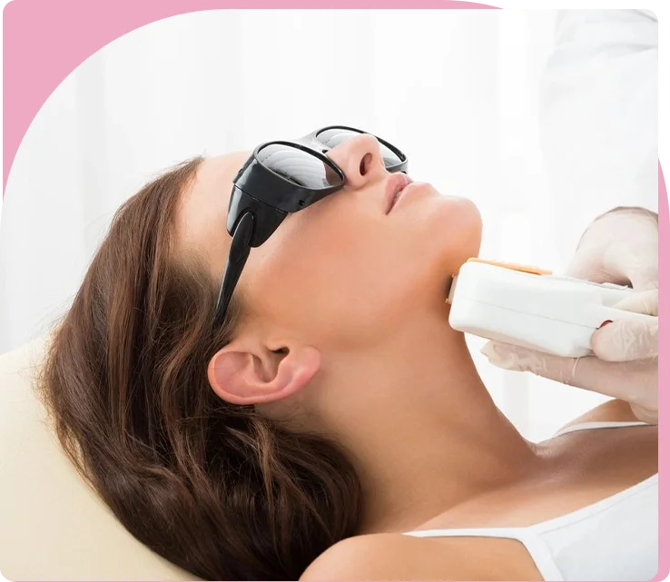 A woman getting her face waxed at the salon