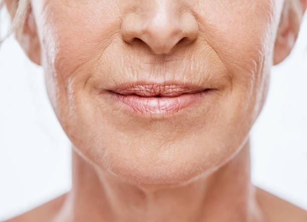 A close up of an older woman 's face