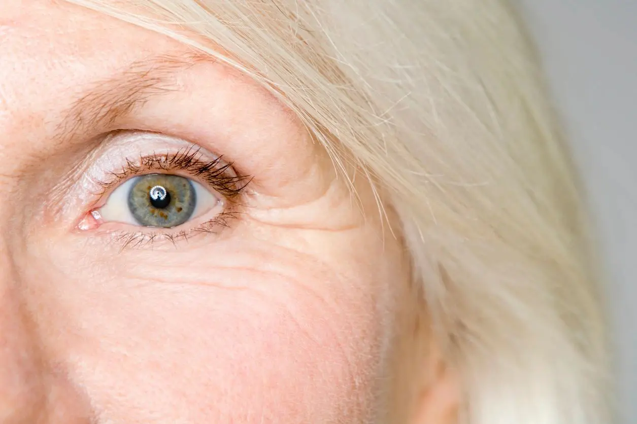 A close up of an older woman 's eye